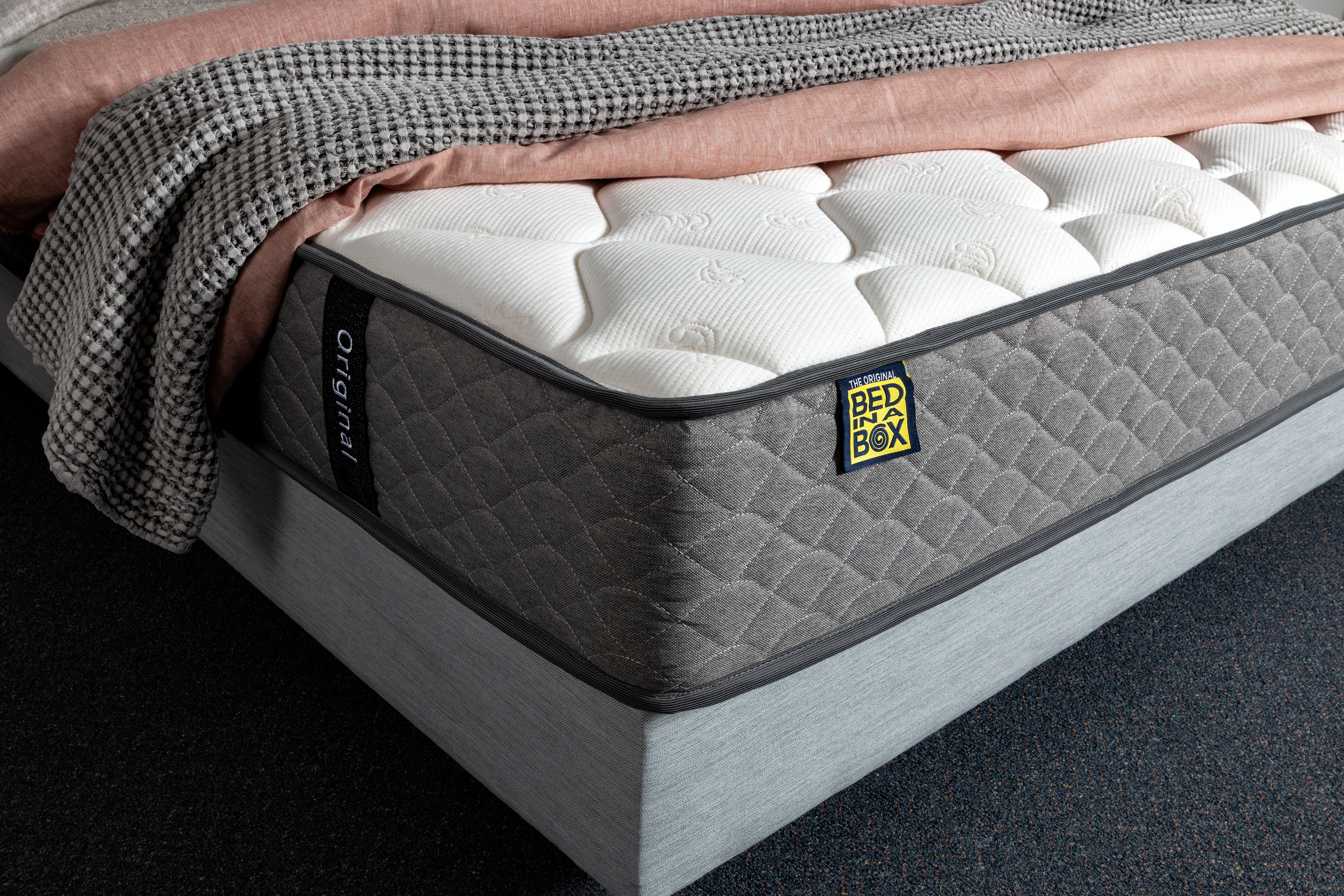 Side view of the Original Bed in a Box mattress showcasing its durable construction and breathable materials for temperature regulation.